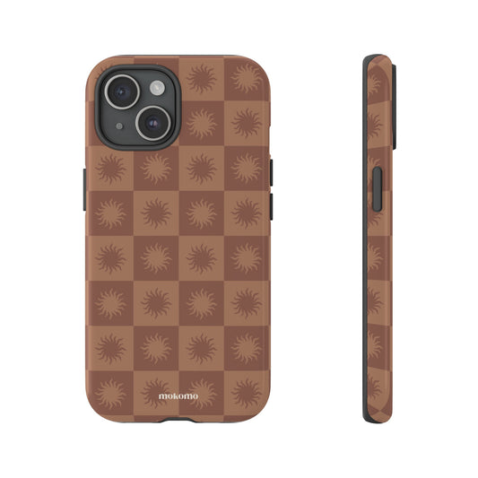 Repeating sun pattern design on IPhone case in brown colour tones 